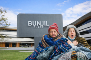 A cold couple huddled in blankets at Bunjil Place, Narre Warren, worried about high winter gas bills in the City of Casey.